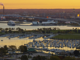 Aerial image of the McKinley Marina looking toward a cruise ship docked near Discovery World. The Milwaukee Community Sailing Center is just visible far left. Veterans Park and other filled lakebed are areas subject to the state's public trust doctrine, which reserves access for public recreational or navigational purposes.