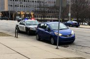 A Milwaukee Police Department officer pulls over a driver on N. Broadway. Photo by Jeramey Jannene.