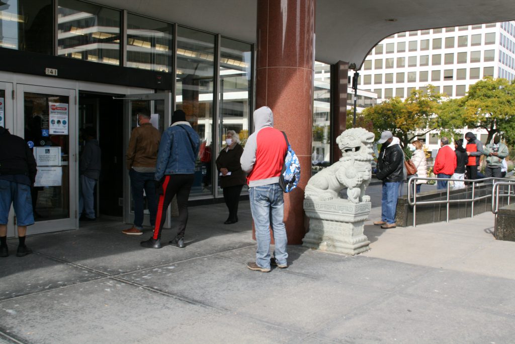 Voters wait in line to vote early at the Zeidler Municipal Building. Photo by Jeramey Jannene.