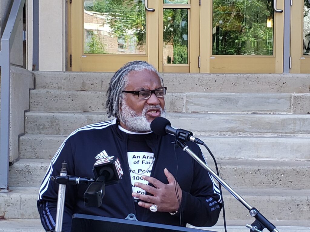 Milwaukee pastor Greg Lewis of Souls to the Polls was one of sever speakers at a news conference and rally Thursday. Participants called on Dane County District Attorney Ismael Ozanne to investigate and prosecute fake electors involved in trying to reverse Wisconsin’s presidential election results in 2020. Photo by Erik Gunn/Wisconsin Examiner.