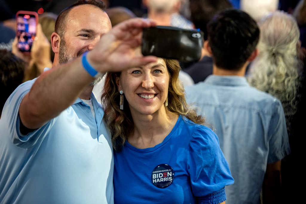 Supporters take a selfie together following President Joe Biden’s speech Friday, July 5, 2024, at Sherman Middle School in Madison, Wis. Angela Major/WPR