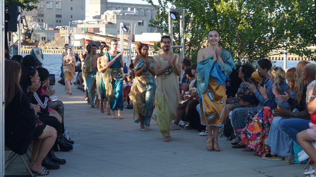 Models wearing Native Nations designs of Sabrina Lombardo walk the runway during Indigenous Elegance at Harbor View Plaza on June 14, 2024. Sponsored by a grant by Joy Engine and organized by the nonprofit Harbor District, Inc., it was the first ever fashion runway event by the water anywhere in Milwaukee. Photo by Michael Timm.